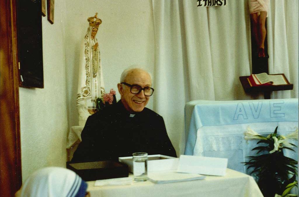 Fr. Hardon sitting and teaching